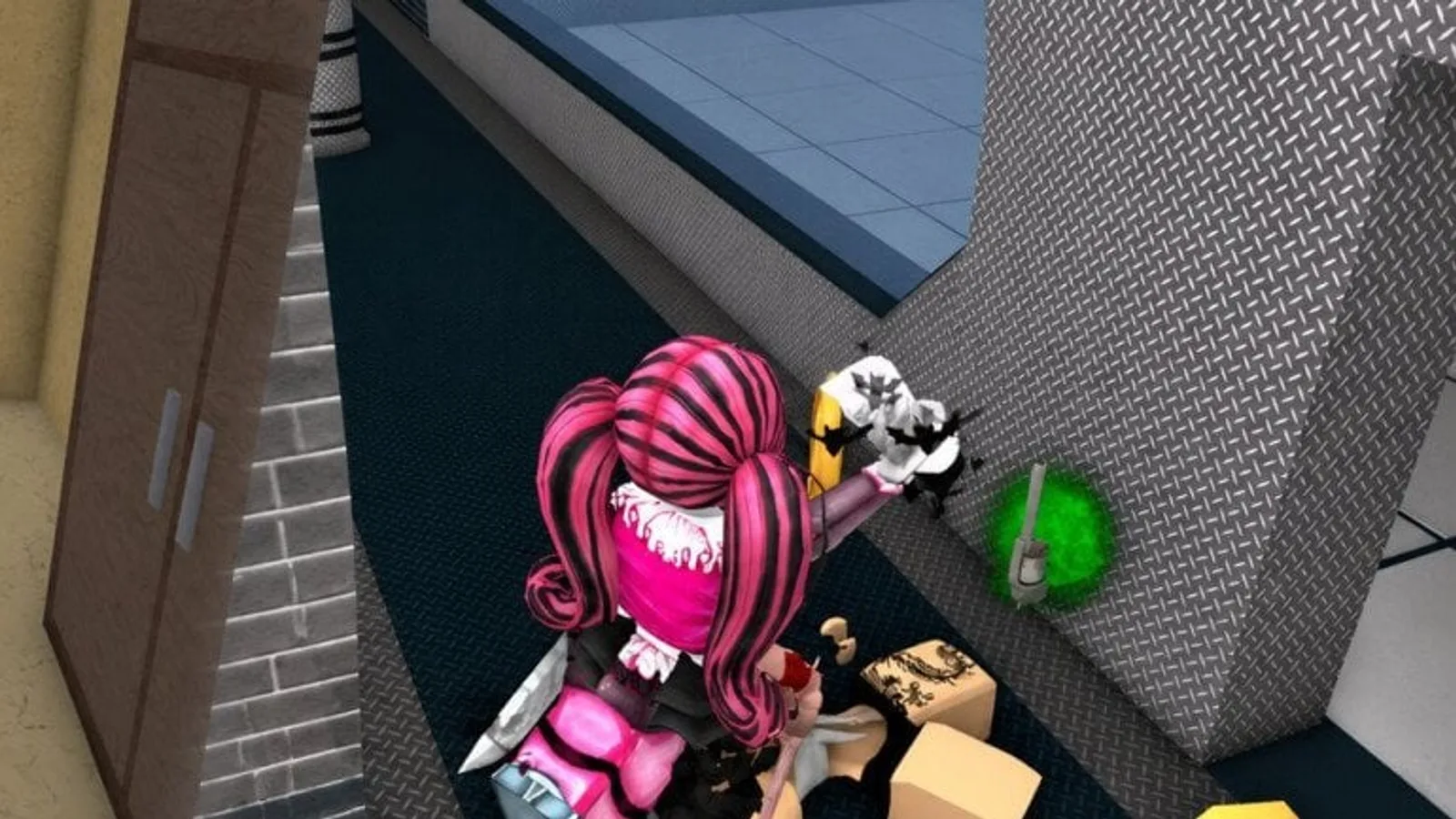 A Murder Mystery 2 player crouched near a diamond-plate wall, reaching toward a glowing green marker beside a cardboard box