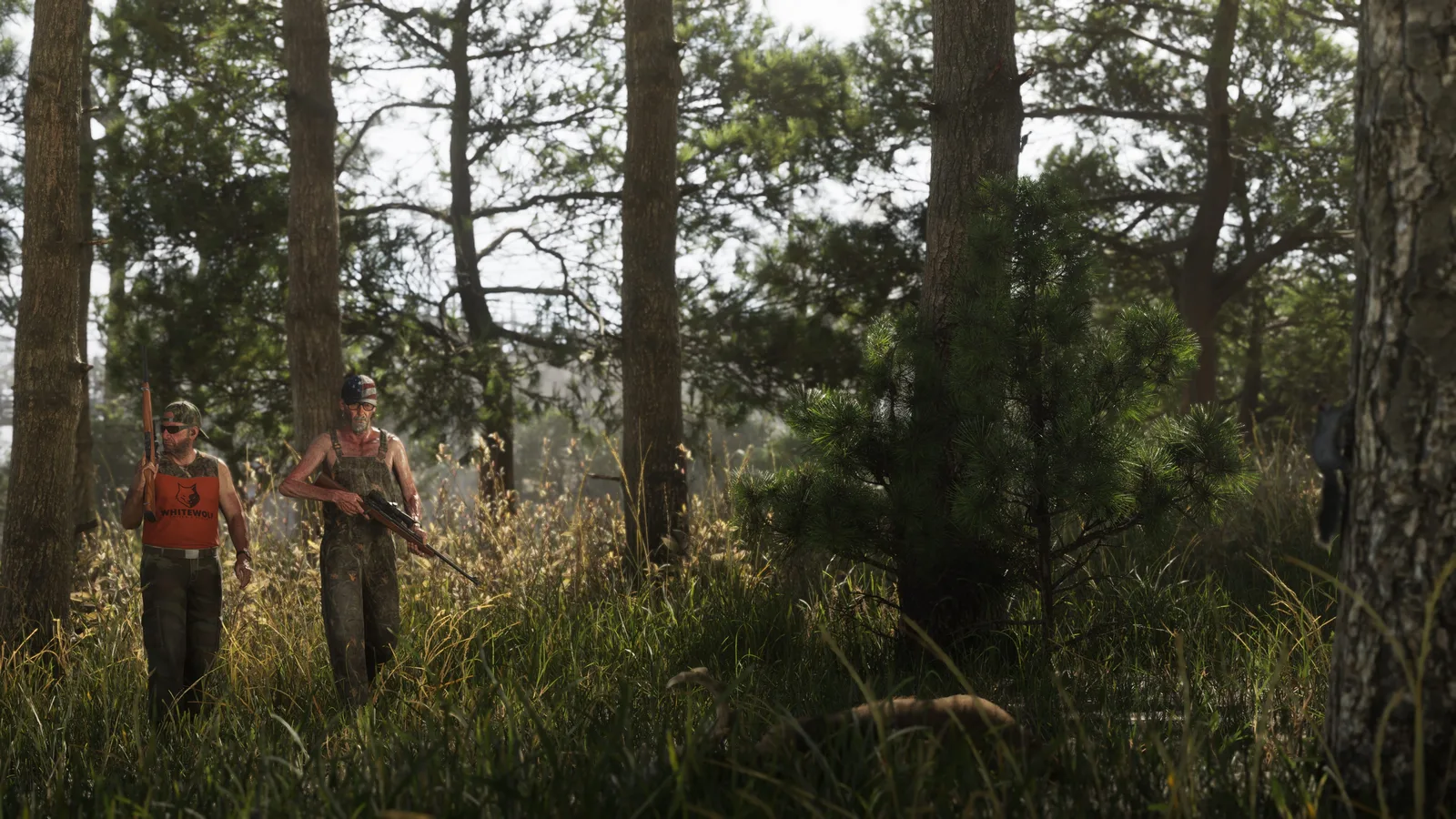 Official screenshot of two hunters carrying rifles through tall grass and pine woods in Mount Kalaga National Park in Grand Theft Auto VI