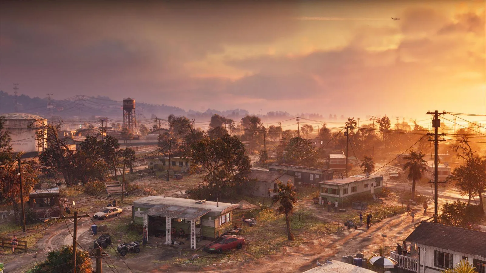 Official Rockstar aerial screenshot of Port Gellhorn's trailer park sprawl at sunset in Grand Theft Auto VI